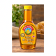 Miel de abeja Naturasol de 250 g marca Shefa en envase transparente con tapa amarilla sobre mesa de madera